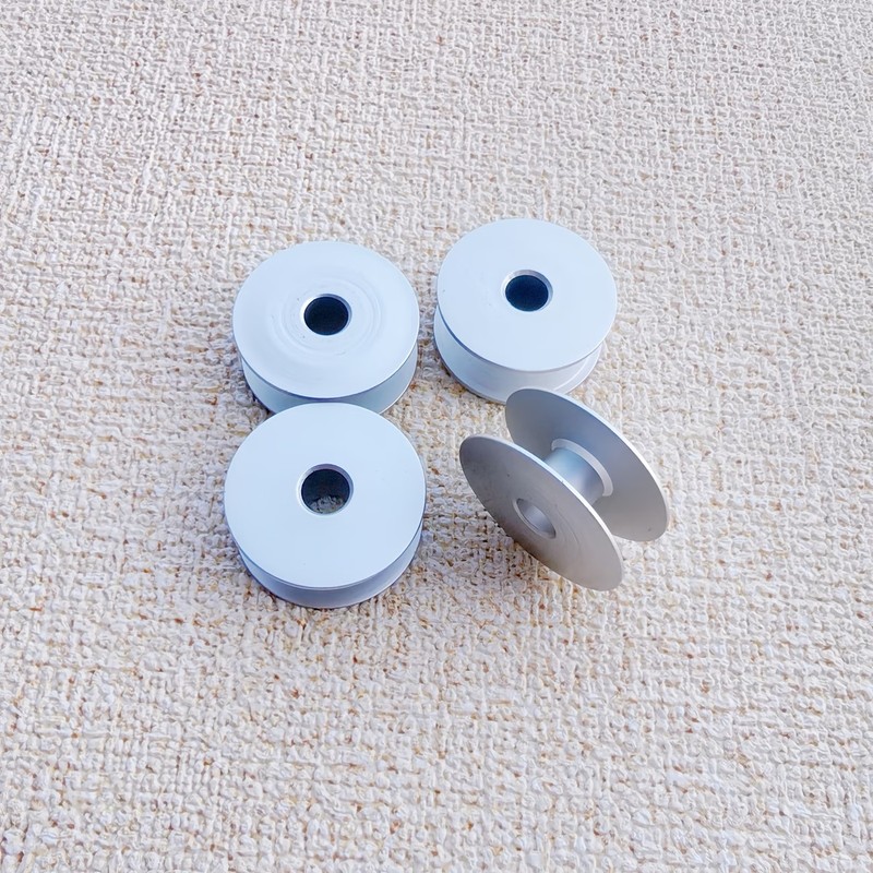 56個の金属製糸ボビン、衣料品生産に適したスムーズな糸の放出 - Sewing Thread Production のレビューと価格